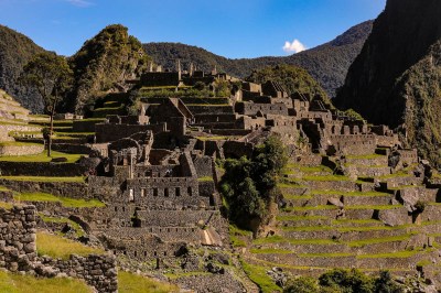 view of a terraced hillside with stone structures, part of Machu Picchu