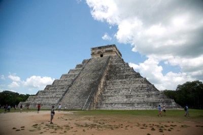 a tall, stepped stone structure with a central staircase in Chichen Itza, Mexico