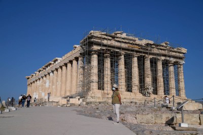 view of the Acropolis, a rectangular structure with dozens of columns, and some scaffolding on the front