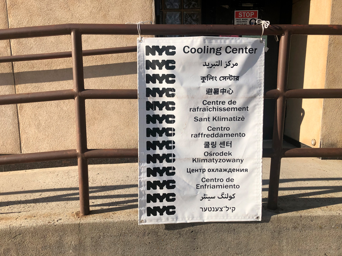 NYC Cooling Center sign in multiple languages, New York State Department of Health, air conditioned facilities where people can get relief during extreme heat, Queens, New York. (Photo by: Lindsey Nicholson/UCG/Universal Images Group via Getty Images)