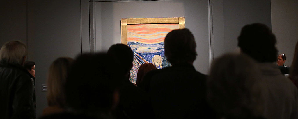 NEW YORK, NY - OCTOBER 25:  People look at Edvard Munch's "The Scream," which went on display in Manhattan's Museum of Modern Art  (MOMA) for a six-month exhibition October 25, 2012 in New York City. The Norwegian artist's most famous motif, and one of the world's most iconic paintings, sold for nearly $120 million at Sotheby's auction house in May and is the only one of four versions that is in private hands.  (Photo by Spencer Platt/Getty Images)