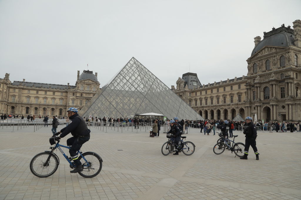 PARIS, FRANCE - MARCH 25: French police takes security measures near louvre pyramid as France raises alert to maximum after the terrorist attack in the Moscow concert hall that killed 137 people, in Paris, France on March 25, 2024. (Photo by Mohamad Salaheldin Abdelg Alsayed/Anadolu via Getty Images)