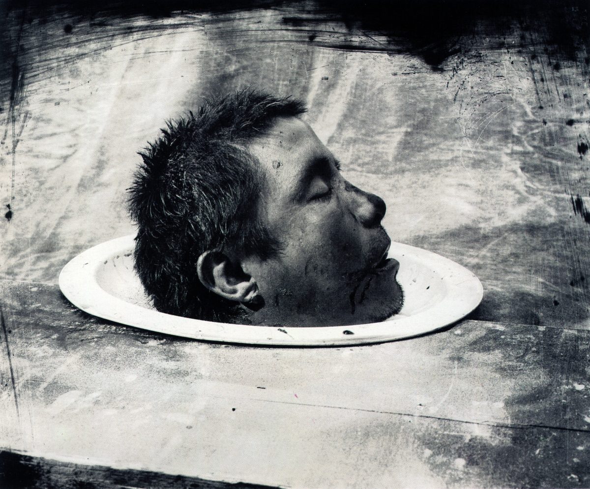 Side view of a man's head on a plate.